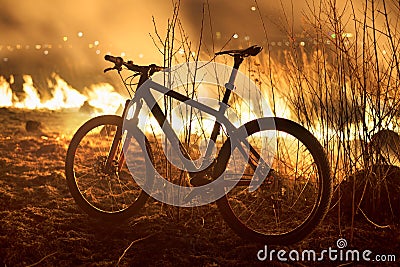 Bike on fire field Stock Photo