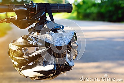 Bike helmet and bike on the street Stock Photo