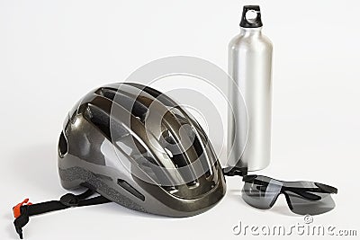 Bike helmet sunglasses and metal water flask Stock Photo