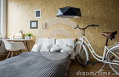 Bike in modern cozy bedroom Stock Photo