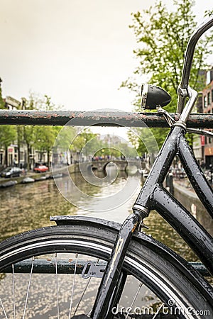 Bike over canal in Amsterdam, The Netherlands Stock Photo