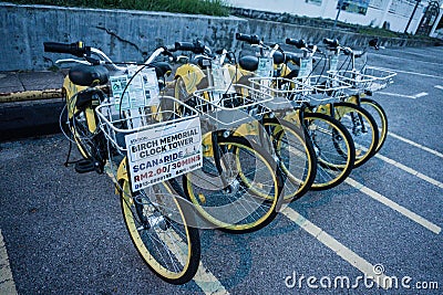 Bike Rental in front of Birch Memorial Clock Tower Editorial Stock Photo