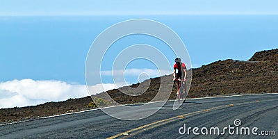 Bike rider above the clouds Editorial Stock Photo