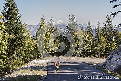 Bike rider on the Col de Leschaux in France Editorial Stock Photo