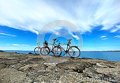 bike on rock stone ,Biking mountain on horizon blue sky white clouds nature panorama seascape landscape Editorial Stock Photo