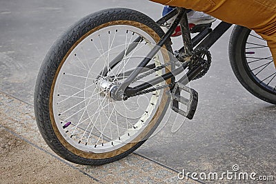 Bike wheel detail with rider. Sport background. Stock Photo