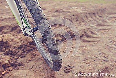 The bike wheel protector treads on the dirty road Stock Photo
