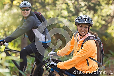 Biker couple riding mountain bike in the forest Stock Photo