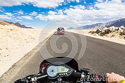 Biker driving a motorcycle in Ladakh in In Stock Photo