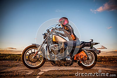 Biker girl on a motorcycle Stock Photo