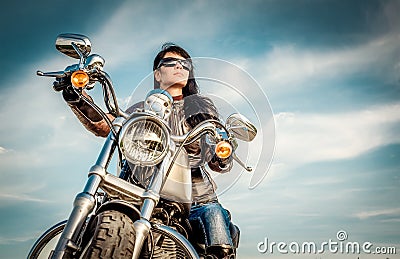 Biker girl on a motorcycle Stock Photo