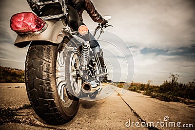 Biker girl riding on a motorcycle Stock Photo