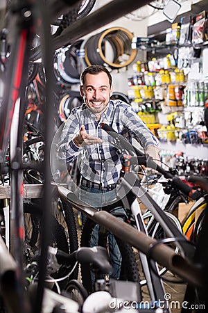 Biker is looking for bicycle handlebars Stock Photo