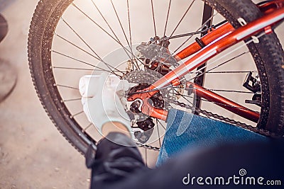 Biker lubricating oil for bicycle chains, Close-up Stock Photo