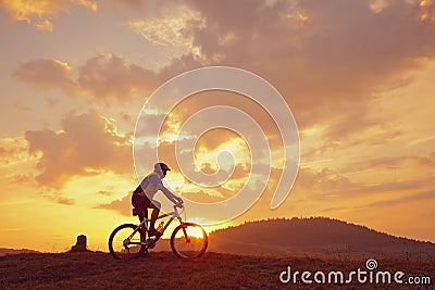 Biker mountain sun clouds Stock Photo