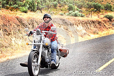 Biker Rides Relaxed Editorial Stock Photo