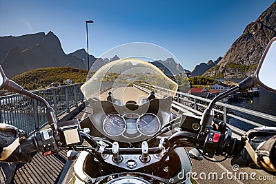 Biker rides on road in Norway. First-person view Stock Photo