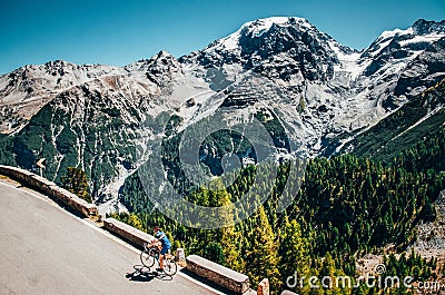 Biker on the road - Cyclist photo. Tour, Italy, Passo dello Stelvio Editorial Stock Photo