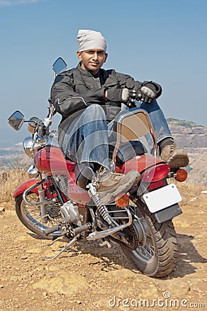 Biker sat back to front on red cruiser Editorial Stock Photo