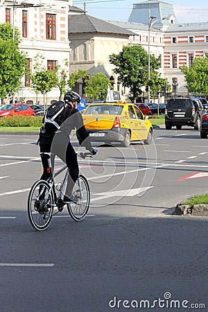 Biker in traffic in Bucharest, Romania Editorial Stock Photo