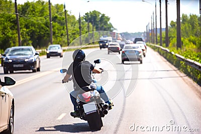Biker in the traffic on the road Editorial Stock Photo