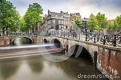 Bikes, boats, canal in Amsterdam, The Netherlands Stock Photo