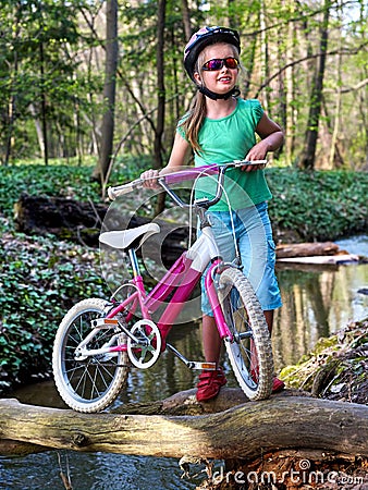 Bikes cycling girl cycling fording throught water . Stock Photo