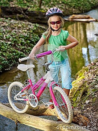 Bikes cycling girl cycling fording throught water . Stock Photo