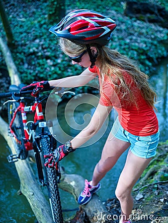 Bikes cycling girl cycling fording throught water . Stock Photo