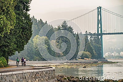 Biking along Stanley Park in Vancouver, Canada Editorial Stock Photo