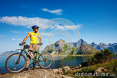 Biking in Norway against picturesque landscape. Bike, active Stock Photo