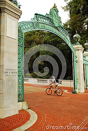 Biking through Sather Gate Editorial Stock Photo