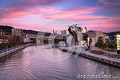 The Guggenheim Museum, Nervion River and La Salve Bridge at Pink Sunset in Bilbao Editorial Stock Photo