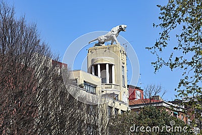 Bilbao, Spain - 22 April, 2022: The Tiger of Deusto, a sculpture by Joaquin Lucarini, sitting on top of a building in the city of Editorial Stock Photo
