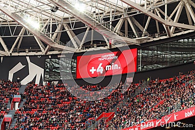 BILBAO, SPAIN - ARPIL 3: Video scoreboard indicates four minutes added, in the match between Athletic Bilbao and Granada Editorial Stock Photo