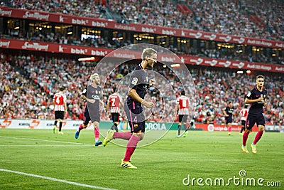 BILBAO, SPAIN - AUGUST 28: Ivan Rakitic and Lionel Messi celebrating a goal of FC Barcelona at the Spanish League match match betw Editorial Stock Photo