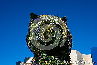 Puppy sculpture covered with flowers by the artist Jeff Koons Editorial Stock Photo