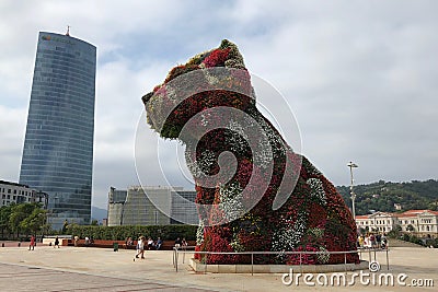 Bilbao, Spain- September 2018: A flower puppy statue in front of Guggenheim Museum in Bilbao, Spain Editorial Stock Photo