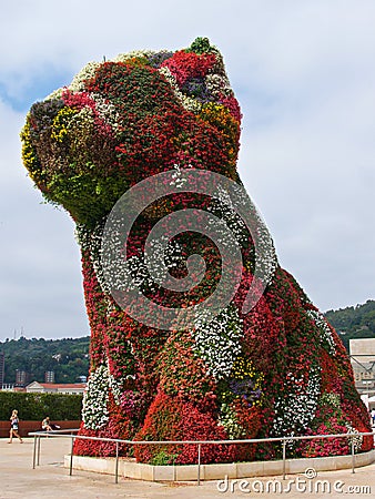 Bilbao, Spain - September 2018: The giant flower puppy outside of Guggenheim Museum in Bilbao, Spain Editorial Stock Photo