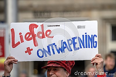 Billboard Liefde + Ontwapening At The International Day Against Racism And Discrimination From The 21 March Comite At Amsterdam Editorial Stock Photo