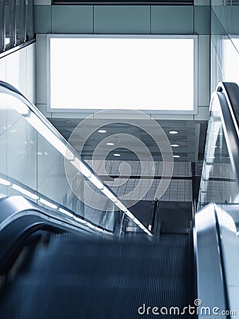 Billboard mocked up in subway station with escalator Stock Photo