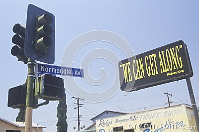 Billboard reading ï¿½We can get alongï¿½, South Central Los Angeles, California Editorial Stock Photo