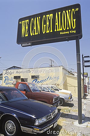 Billboard reading ï¿½We can get alongï¿½, South Central Los Angeles, California Editorial Stock Photo