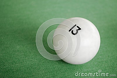 Billiard Ball number 13 on a pool table. A close-up image of an number thirteen ball on a pool table Stock Photo