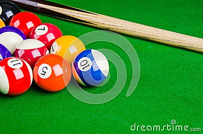 Billiard balls on green table with billiard cue, Snooker, Pool. Stock Photo