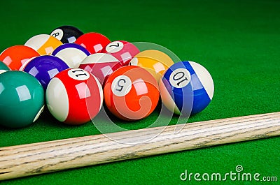 Billiard balls on green table with billiard cue, Snooker, Pool. Stock Photo