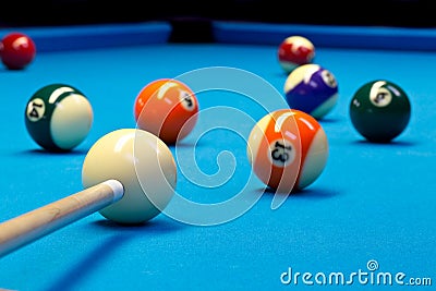 Billiard pool eightball taking the shot on billiard table Stock Photo