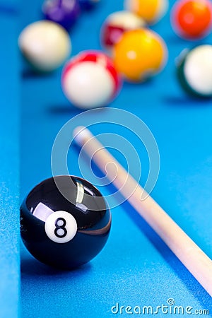 Billiard pool game eight ball with cue on billiard table Stock Photo