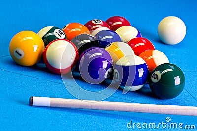 Billiard pool game eight ball setup with cue on billiard table Stock Photo