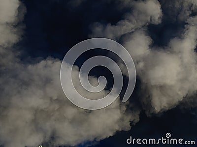 Billowing black smoke from a burning factory. Stock Photo